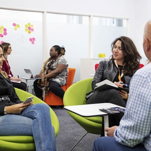 Photo of students being advised in The Hive