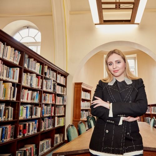 Student stood in library