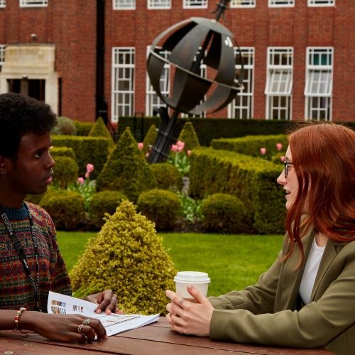 Academic and student in The Quad